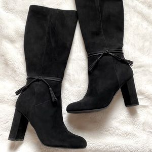 Tall black suede boots with tassel